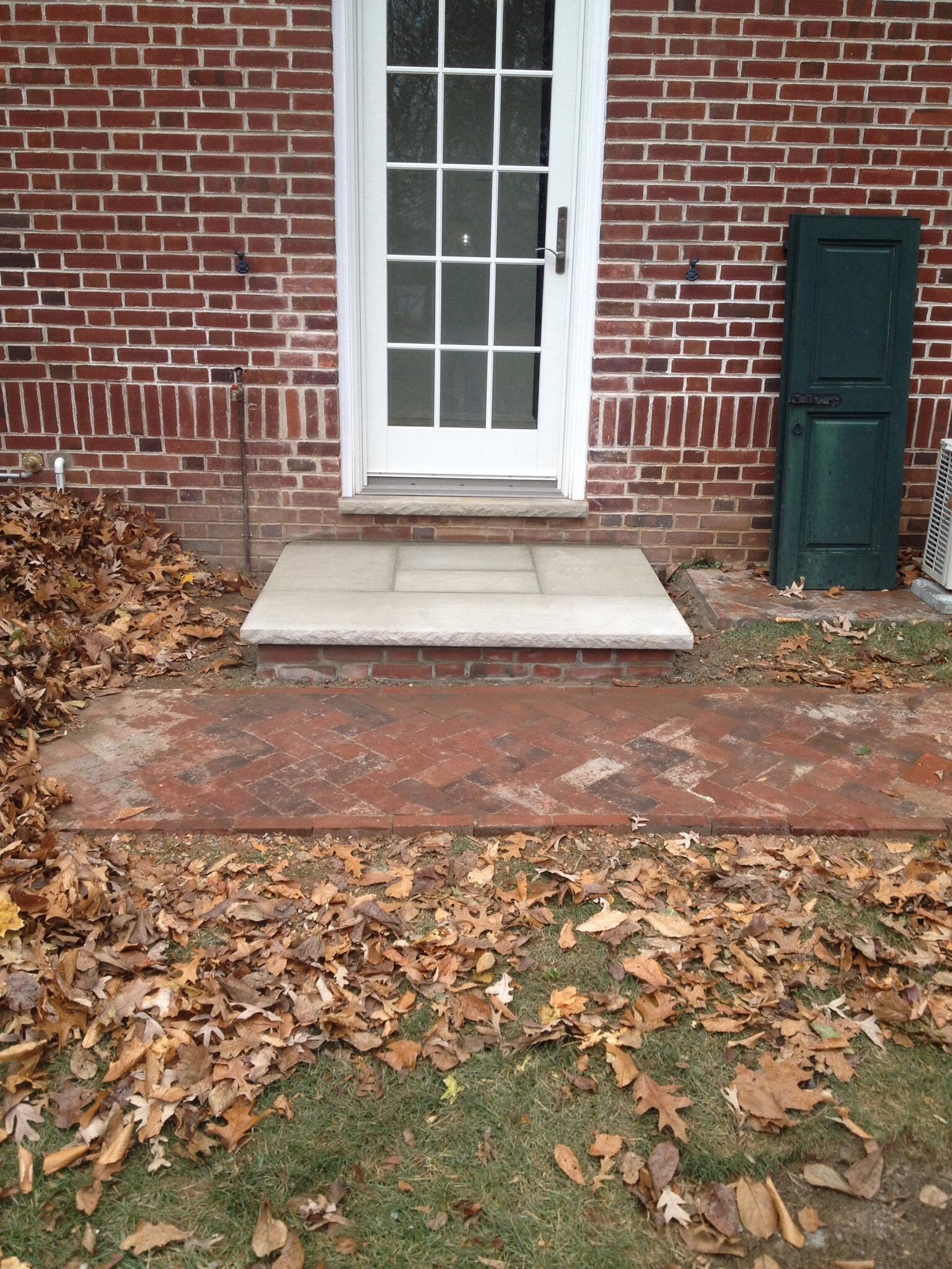 Brick walkway and limestone landing