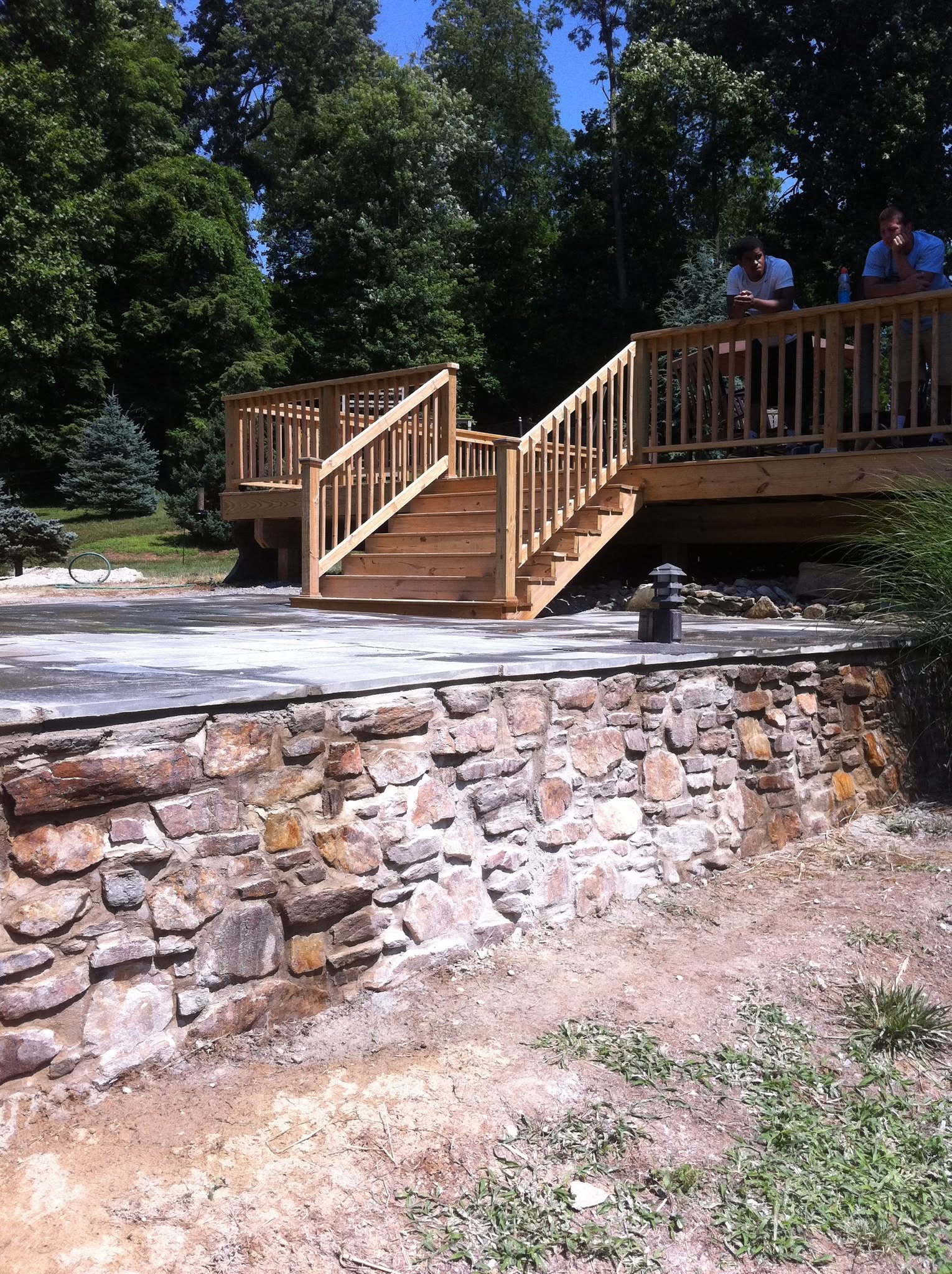 Cedar deck over stone retaining wall